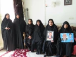 دیدارریاست و جمعی از کارکنان آموزشکده ملی مهارت دختران میبد با خانواده شهیدمحمد حسین محمدی
 14